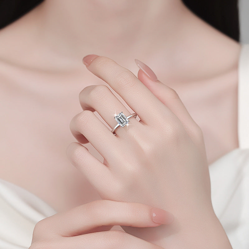 Minimalist, chic, and stylish 925 silver ring for women, featuring an emerald-cut moissanite and 18K gold plating.