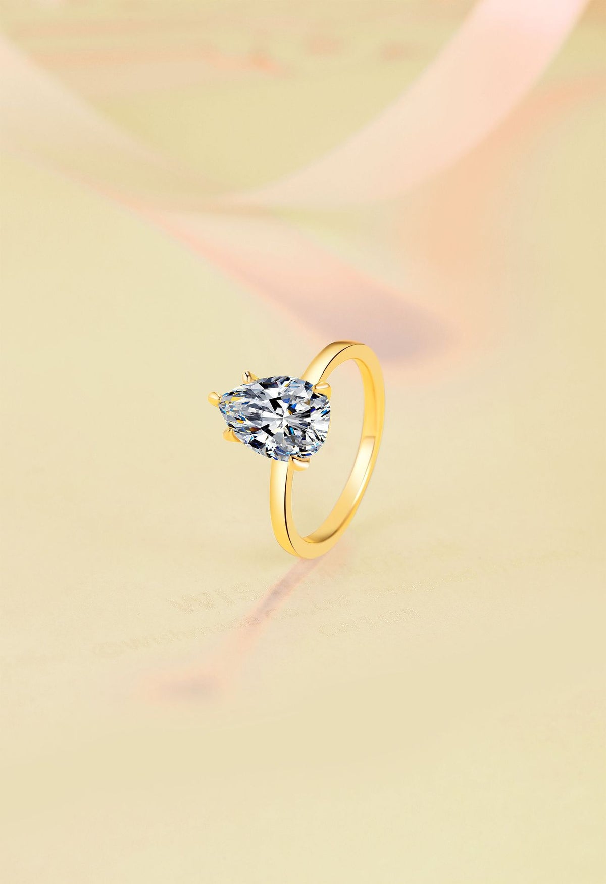 Hot-selling 925 sterling silver ring with 18K gold plating—a stylish, minimalist band featuring a pear-shaped (teardrop) moissanite.