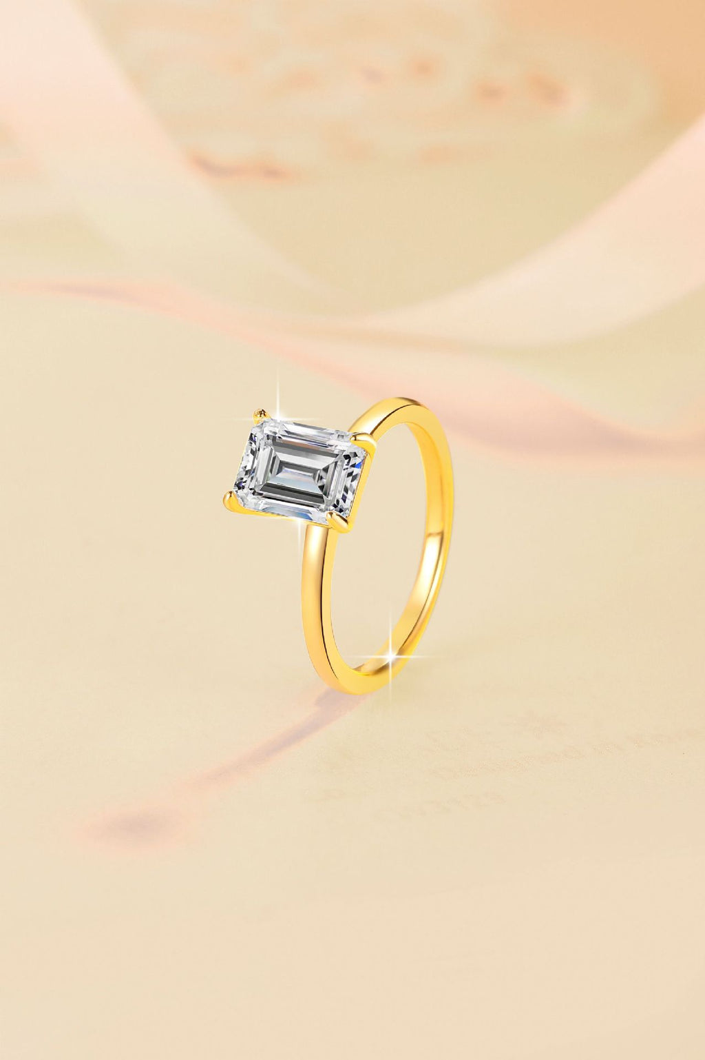 Minimalist, chic, and stylish 925 silver ring for women, featuring an emerald-cut moissanite and 18K gold plating.